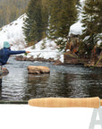 R.L. Winston Air 2 Fly Rod shown with angler casting on snowy mountain river at Freestone Fly Shop