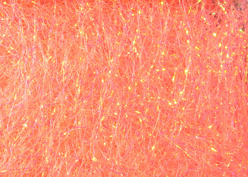 Ice Dub fibers in glowing peach shades with luminous sparkle by Hareline Dubbin, Inc at Freestone Fly Shop for fly tying