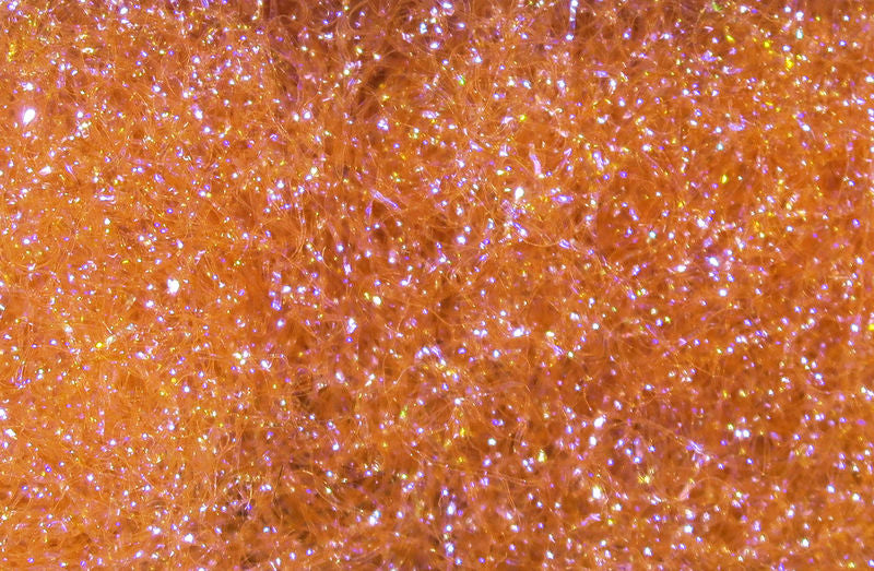 Ice Dub fibers in vivid orange with iridescent sparkle by Hareline Dubbin, Inc at Freestone Fly Shop for fly tying
