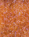 Ice Dub fibers in vivid orange with iridescent sparkle by Hareline Dubbin, Inc at Freestone Fly Shop for fly tying